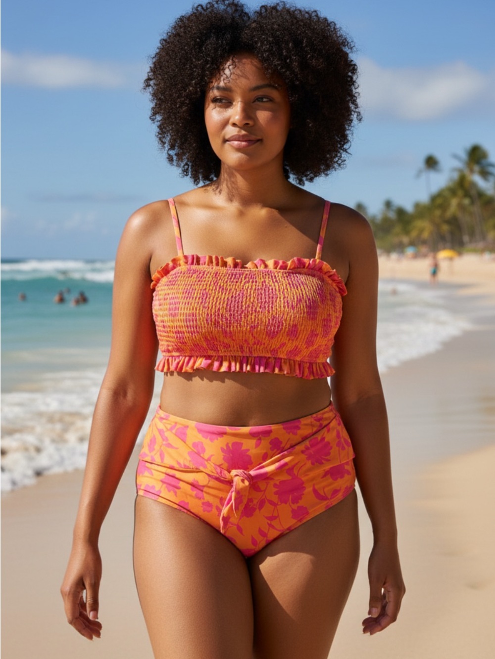 AndTheWhy smocked bikini set with a vibrant orange and hot pink floral pattern